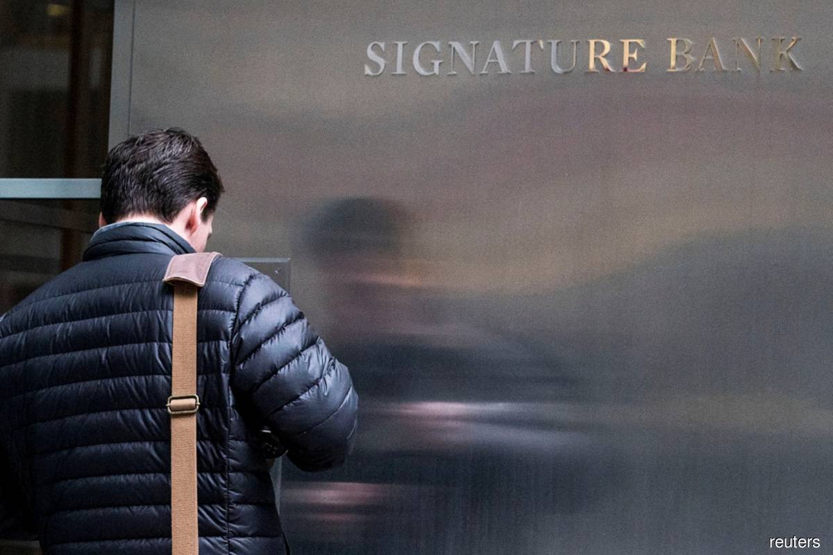 A worker arrives to the Signature Bank headquarters in New York City March 12, 2023. (Reuters pic)